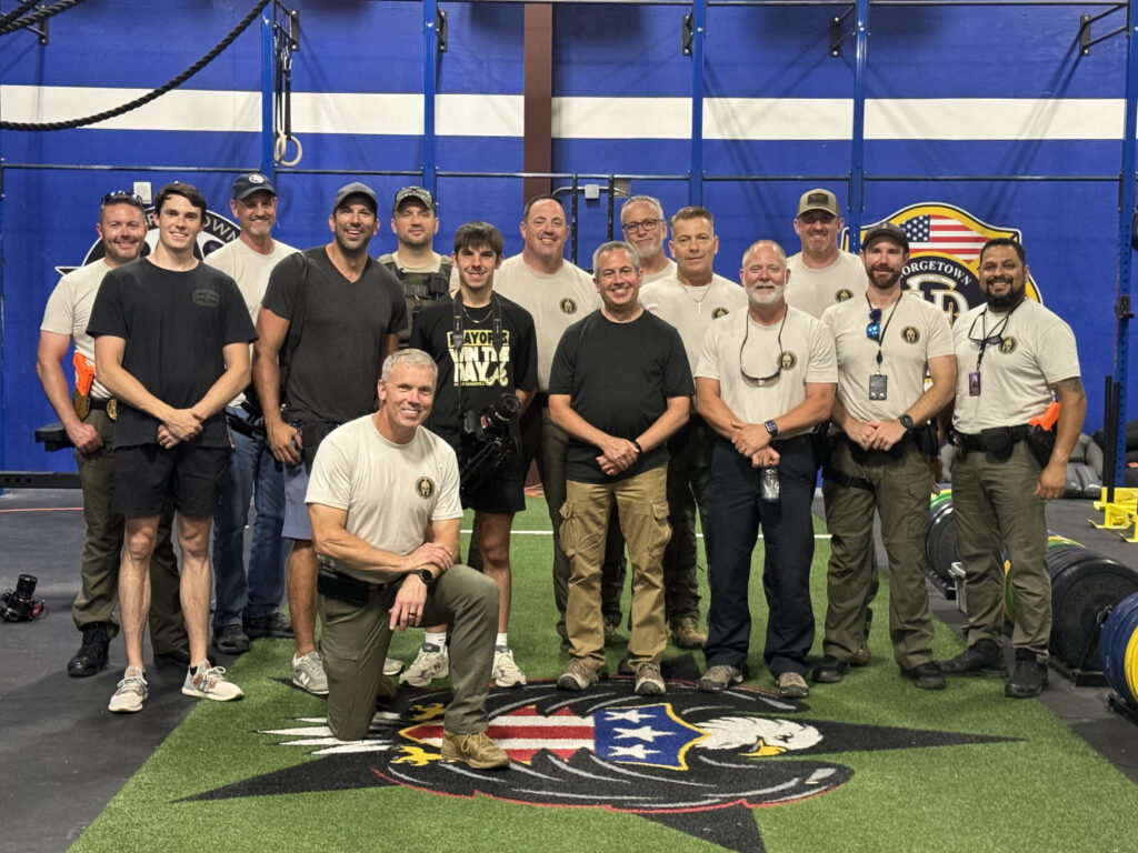 Members from a Vincible Training pose for a photo.